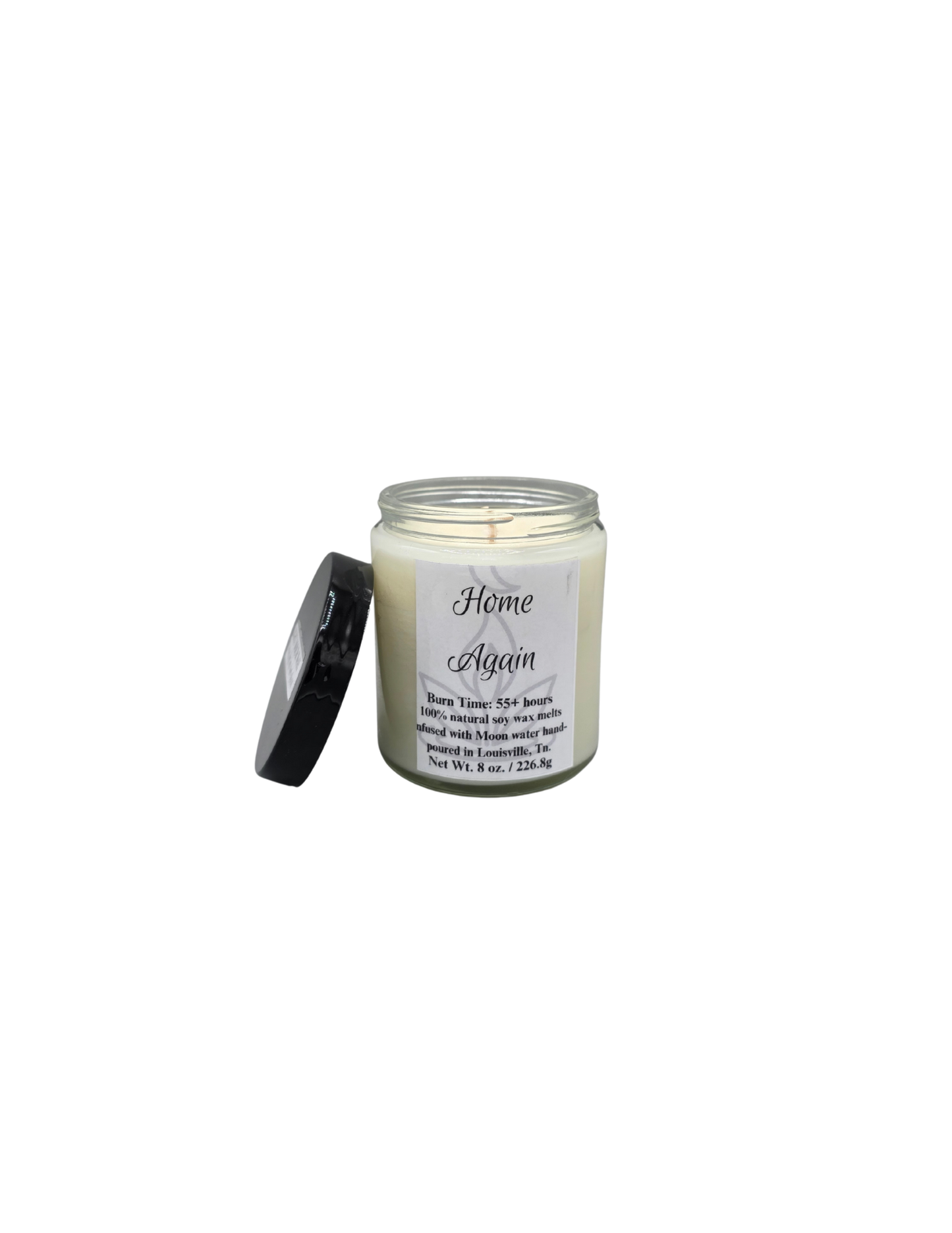 Candle jar labeled 'Home Again' on a white background with black lid
