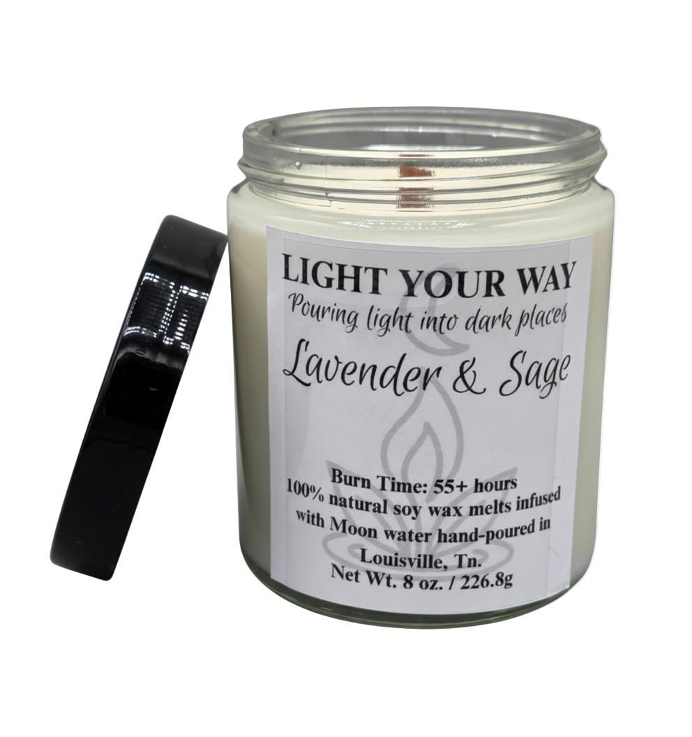 Candle with a label and a black lid on the side