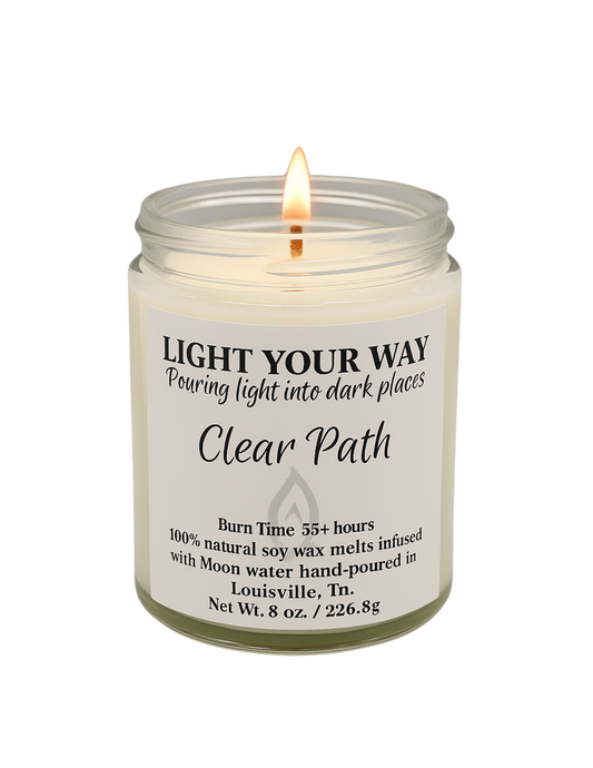 Candle in a glass jar with a label that says clear path