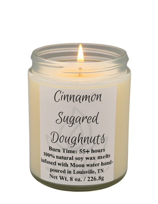 Candle in a glass jar with a label on a white background