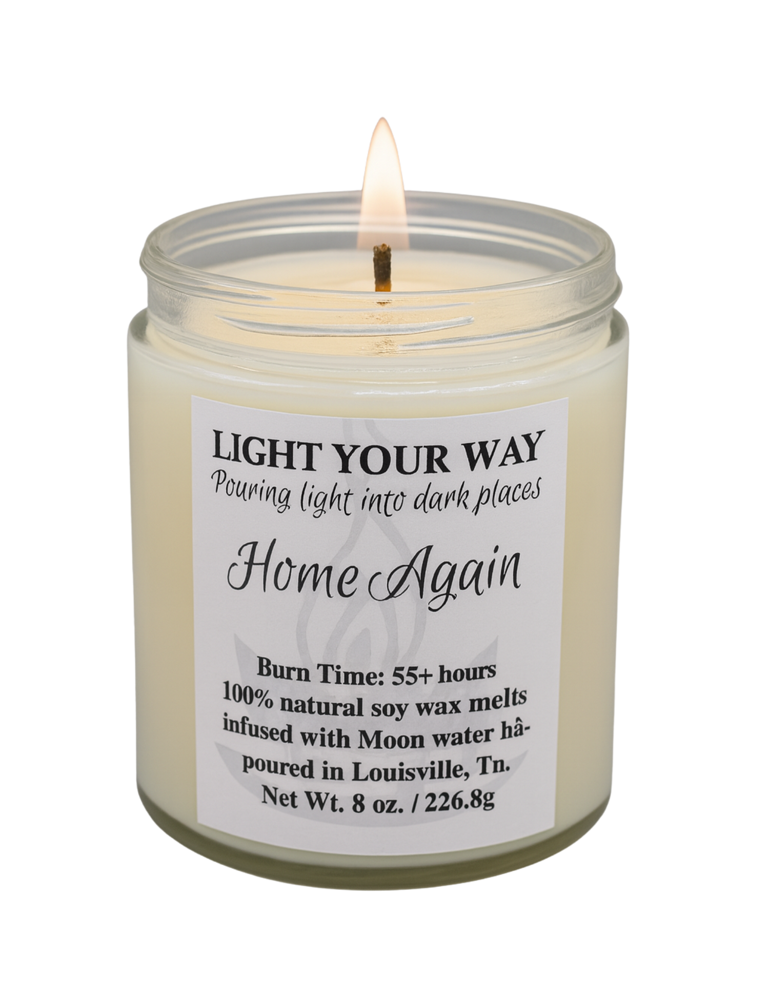 Candle in a glass jar with a home again label on a white background