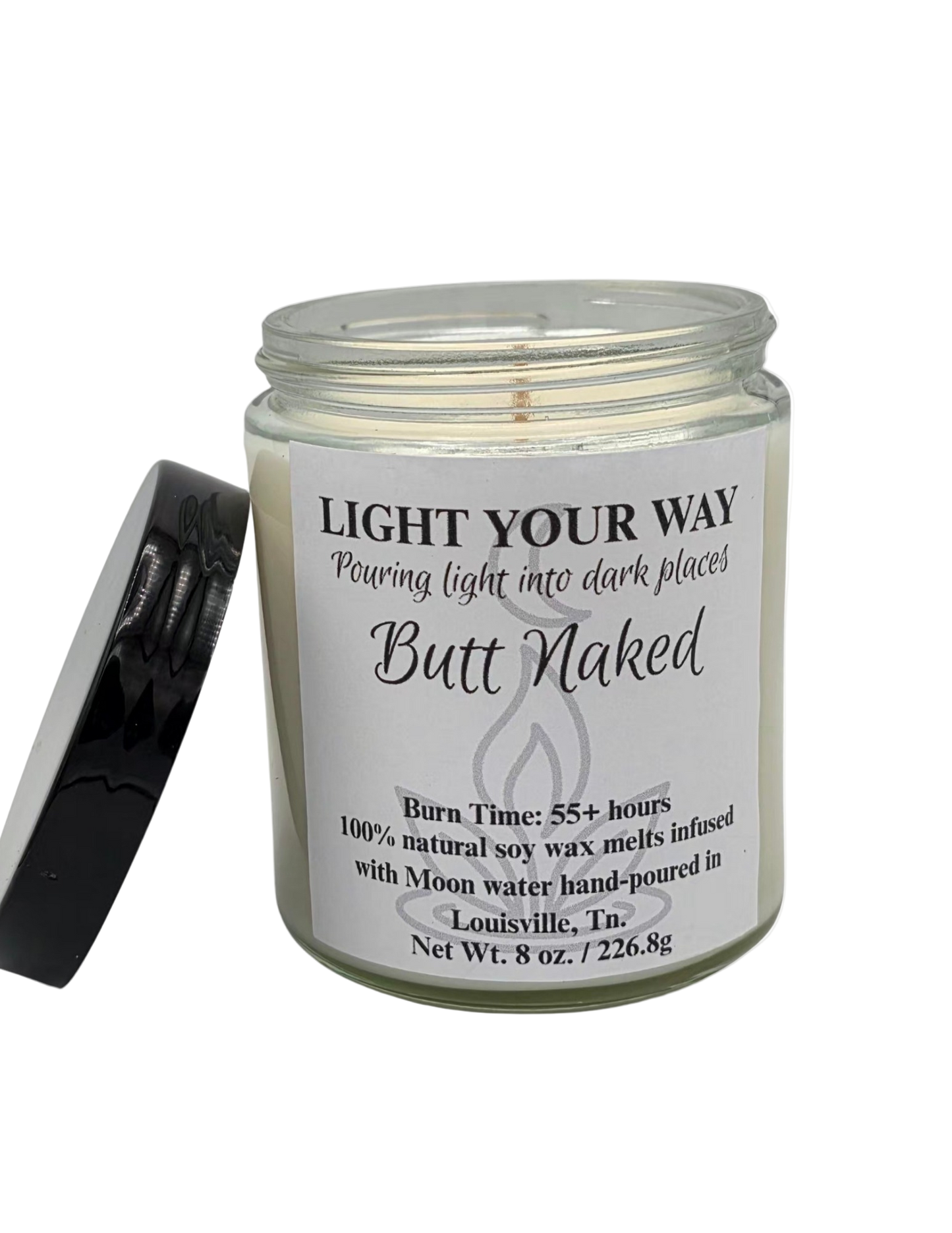 Candle jar with a label reading 'Light Your Way Butt Naked' on a white background