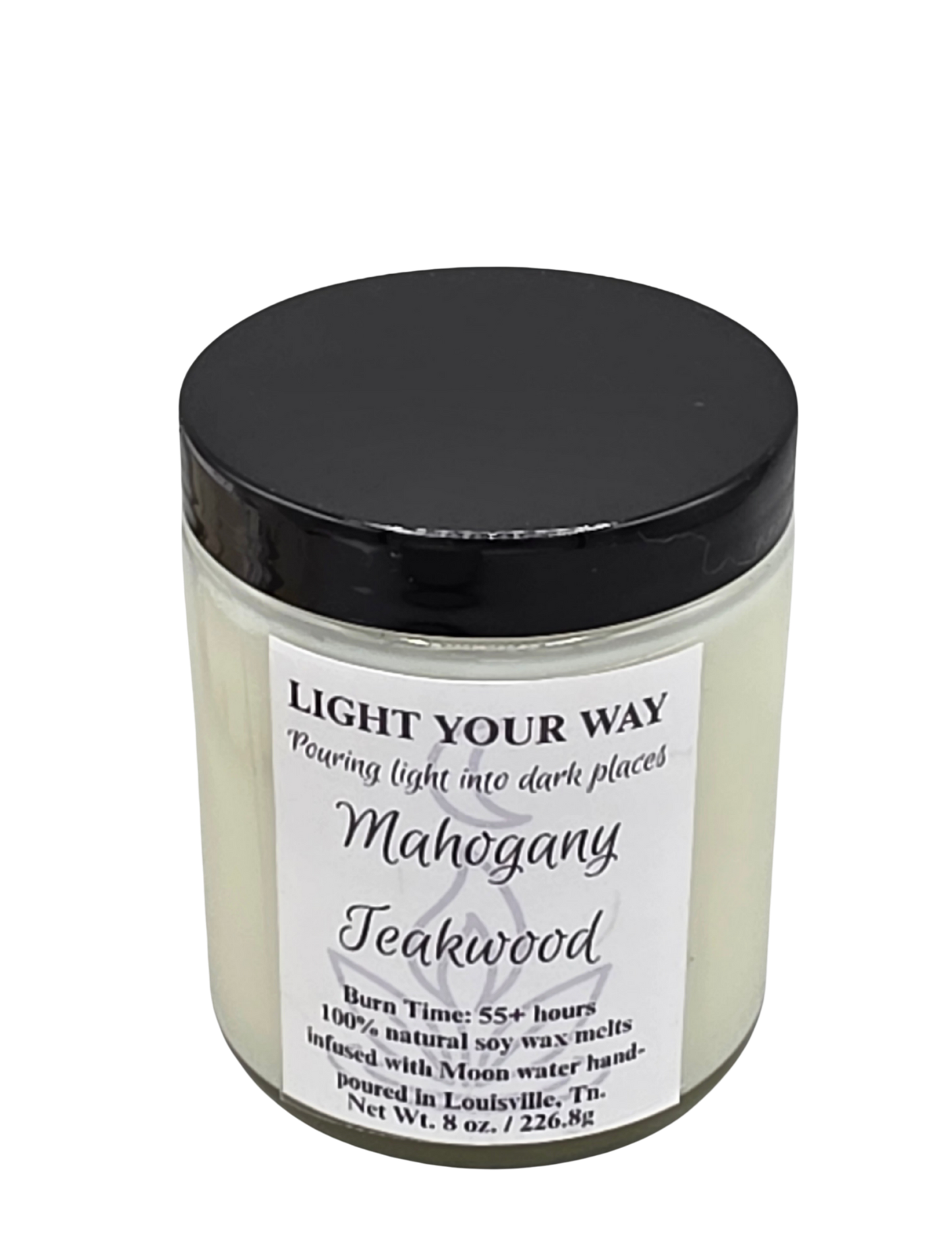 Candle jar with black lid and white label