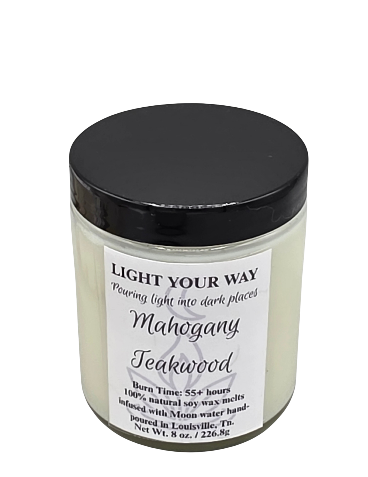 Candle jar with black lid and white label