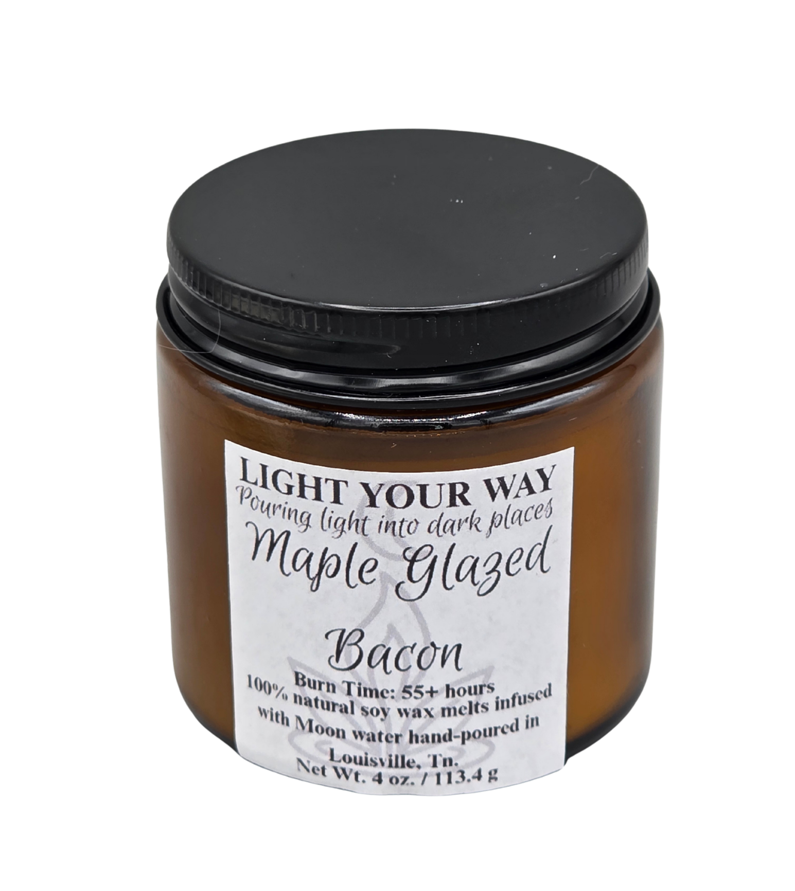 wickless candle in amber jar labeled 'Maple Glazed Bacon' with a black lid on a white background