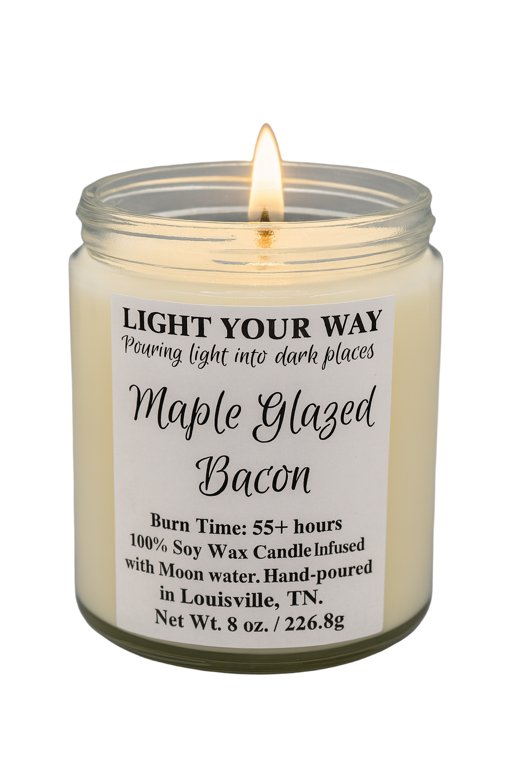 Candle with a label reading 'Maple Glazed Bacon' with a flame